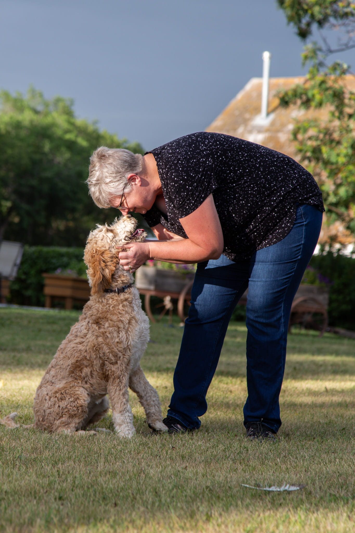 Sonia holding her dog's face